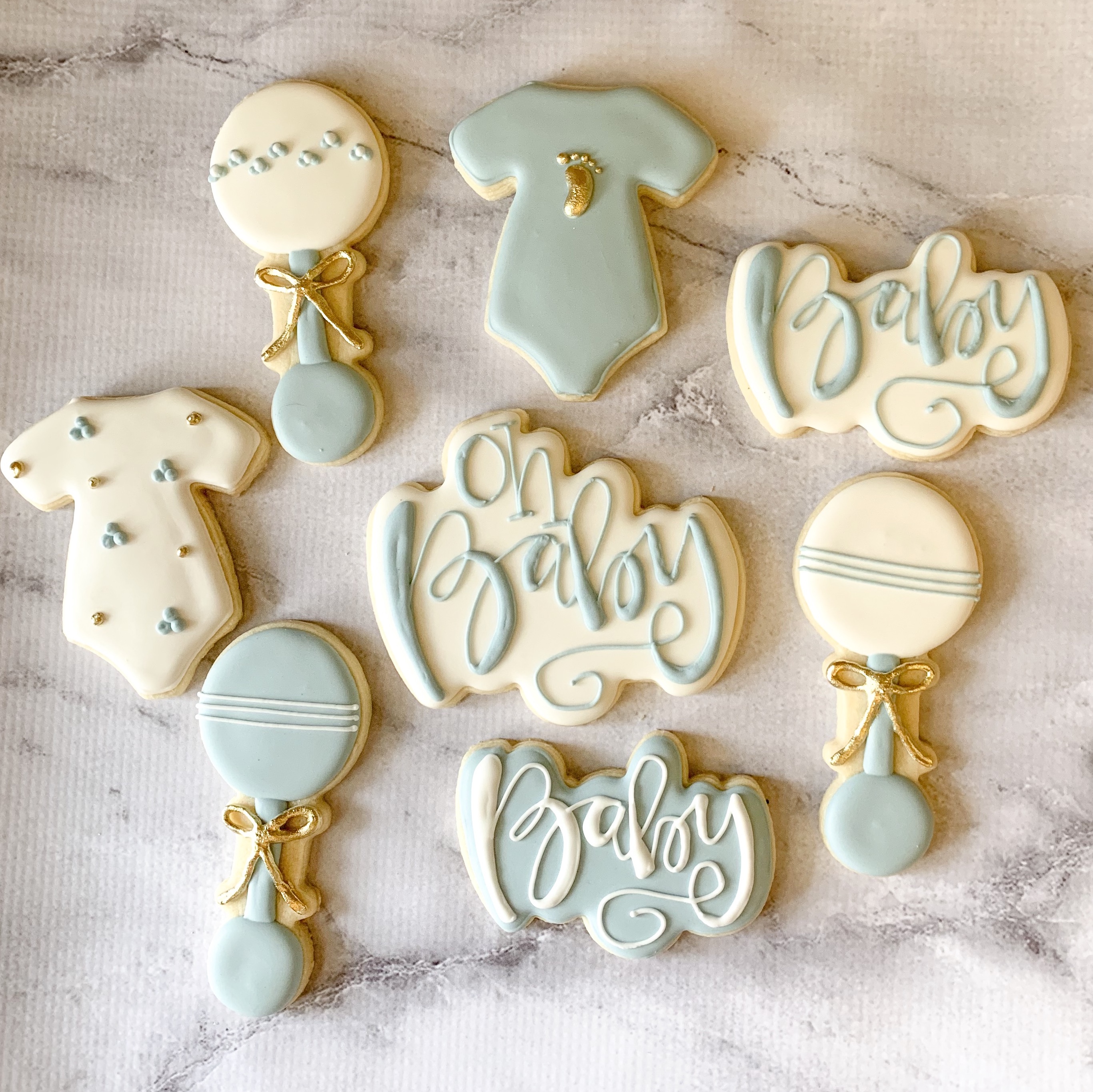 Picture of blue and white baby shower cookies.